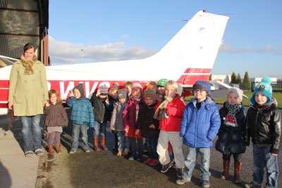 Toddlers in front of Cessna