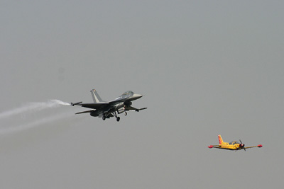 Belgian F-16 and Marchettif SF-206 in formation