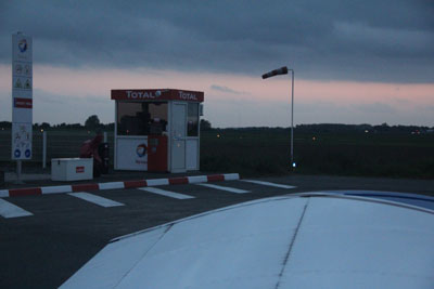 At the fuel pump in Lille at dusk