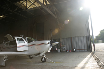 Mooney looking outside the hangar