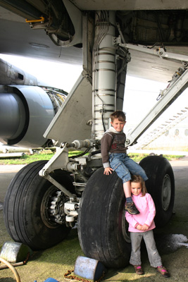 Kids on 747 undercarriage